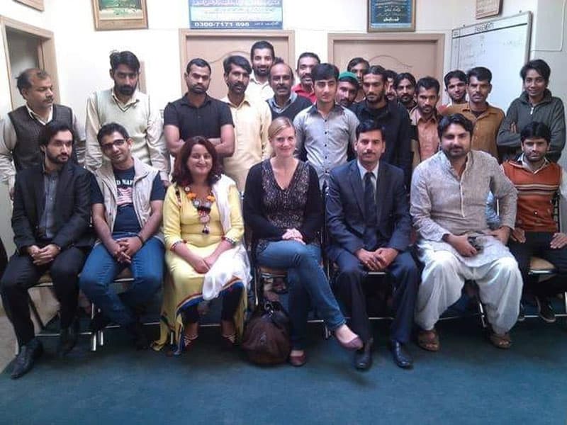 Silver Lining staff meeting with a visiting delegation