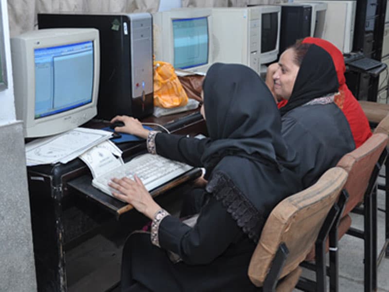 Women receiving computer training at a Skill Development Unit